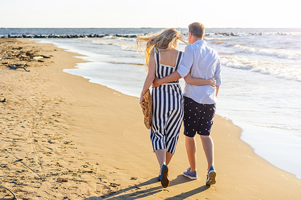 Couple walking by the beach in Marco Island